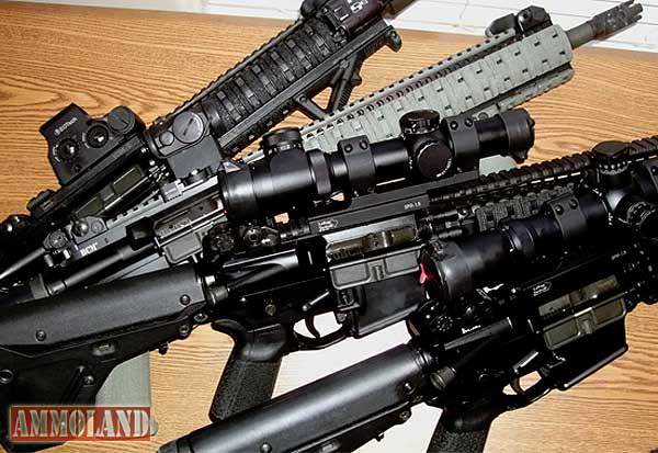 pile of ar15 rifles