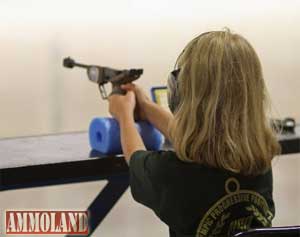 A young female competitor in USA Shooting