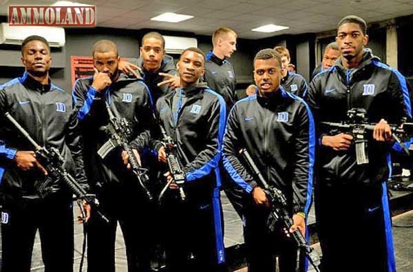 Duke Basketball players holding fake firearms after a gun safety course