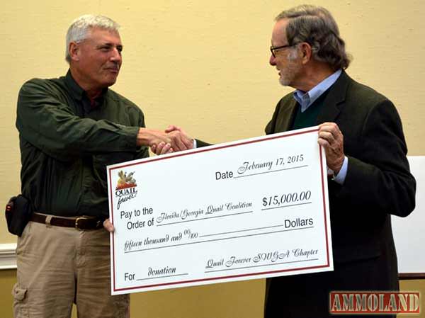 Bobby McKinney, president of the Southwest Georgia Chapter of Quail Forever, presents a check to the Florida/Georgia Quail Coalition for ongoing bobwhite quail conservation efforts.