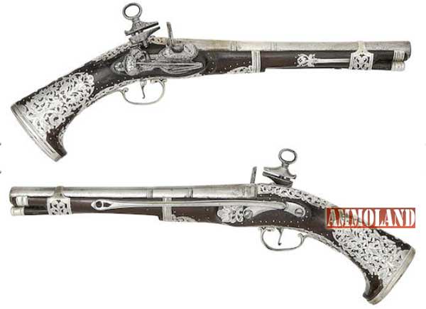 A Rare Pair Of 20-Bore South American Silver-Mounted Miquelet-Lock Belt Pistols