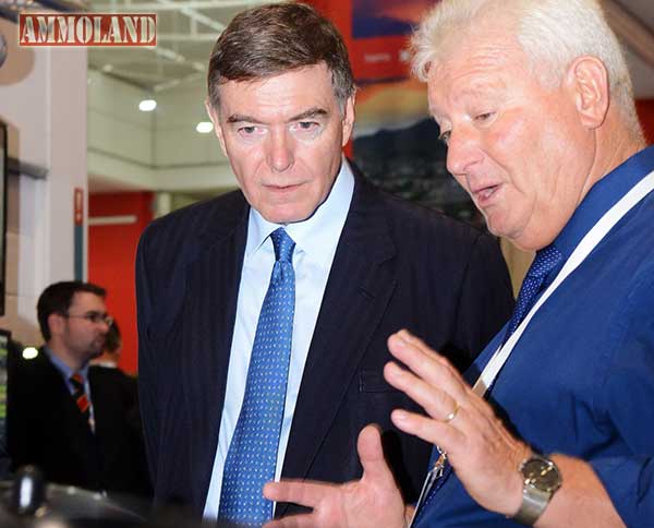 Barry Davies (1st right) briefs the UK Minister for Defence Procurement, Philip Dunne MP, at last year's DSEI event in London.