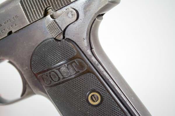 The Colt Model 1903 Pocket Hammerless Pistol and variant 1908 sport grip and thumb safeties.