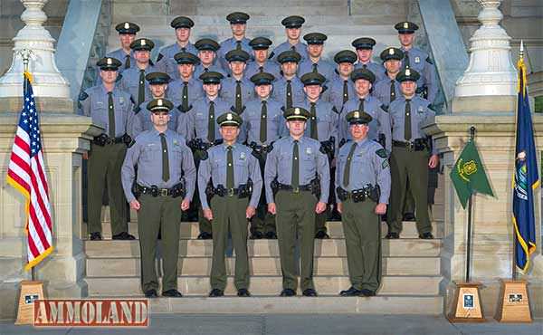 Michigan DNR Graduates 16 New Conservation Officers : The 16 graduating conservation officer academy recruits from Recruit School No. 7 are pictured with 10 Department of Natural Resources Law Enforcement Division officials and academy staff, who were instrumental in their success. Pictured in the front row, left to right, are 1st Lt. Steven Burton, Assistant Chief Dean Molnar, Chief Gary Hagler and Sgt. John Meka. Recruit school commander, Sgt. Jason Wicklund, is pictured in the second row to the far right.