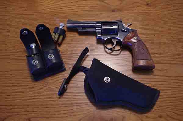 I use an Uncle Mike's holster and carry H&K speed loaders when carrying my Smith & Wesson Model 19 Revolver in . 357 Magnum Ammo.