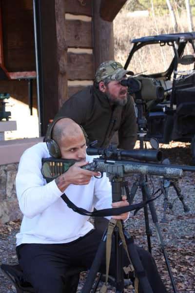  Retired Army Staff Sergeant Philip Saladin takes aim while Hope For The Warriors' staff member Dave Williams guides him during a four-hour precision shooting class