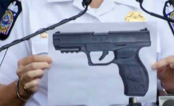 CPD Chief Kim Jacobs holds an image of the BB Gun recovered at the scene. (WCMH)