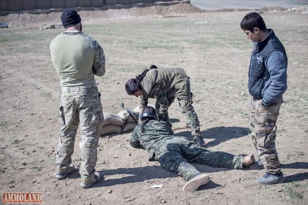 Syrian Women Training Against ISIS A U.S. Army Special Forces soldier advises a Manbij Military Council instructor as she helps a MMC trainee during marksmanship training at Sanaa Training Center in Syria, Feb. 22, 2017. The MMC is a multi-ethnic force that includes Kurds, Arabs, Christians, Turkmen, Yazidis and others. The course is administered by Special Operations Joint Task Force Operation Inherent Resolve trainers. Army photo by Master Sgt. Mark Burrell