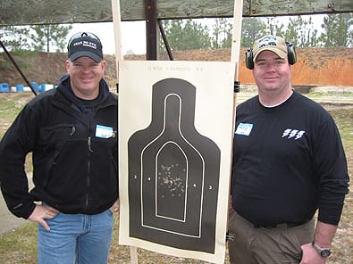 2nd Gulf War Veterans, Scott (left) and Matt Isbell proudly display their target during the HAVA shooting event