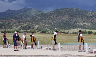 COLORADO SPRINGS, Co--Under threatening skies, Staff Sgt. Josh Richmond, U. S. Army Marksmanship Unit, fires on his target during the finals of the double trap event July 13 at the U.S. National Shotgun championships. Richmond outlasted the field and the elements to claim the gold medal. (Photo by Michael Molinaro, USAMU PAO)