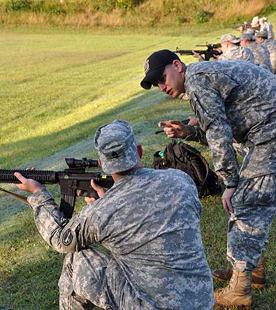 FORT BENNING, Ga.--Sgt. Calvin Roberts, U.S. Army Marksmanship Unit, instructs a Soldier during a squad designated marksman class Oct. 7 at Easley Range. The USAMU instructs thousands of Soldiers each year to raise the combat readiness throughout the Army. The unit is led by its NCOs, who make up for more than 80% of the unit's personnel. (Photo by Mike Badger)