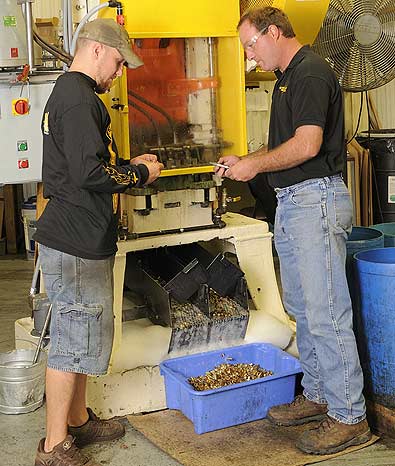 Employees oversee Starline Brass's New Draw Press while working hard to keep up with Ammunition Production