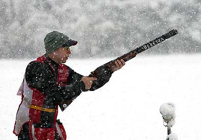 BEIJING -- In a driving snowstorm, Sgt. Vincent Hancock, U.S. Army Marksmanship Unit, prepares for a target during the World Cup Final in Men's skeet at the Beijing Olympic Range. Hancock, the current Olympic, World and National champion in Men's skeet, earned a silver medal and closed out a successful 2009 competitive season. (Photo courtesy of Marco Dalla Dea)