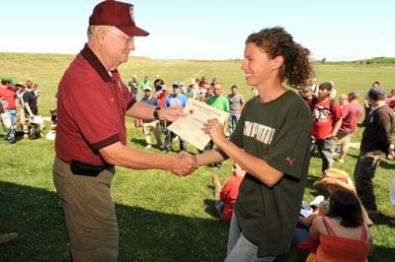 While DCM, Anderson was dedicated to growing youth participation in the shooting sports. He is shown here awarding a certificate to a CMP-USMC Junior Highpower Clinic participant. 