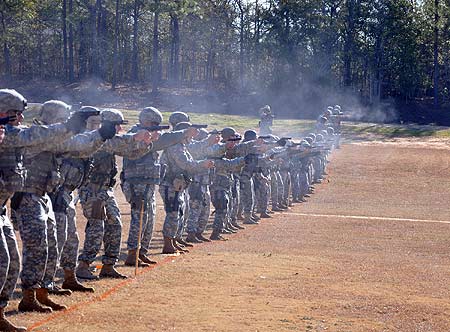 FORT BENNING, Ga.--Soldiers fire the first rounds of the 2010 All-Army Small Arms Championships downrange Feb. 21 at Parks Range during pistol match one. (Photo by Michael Molinaro, USAMU PAO)