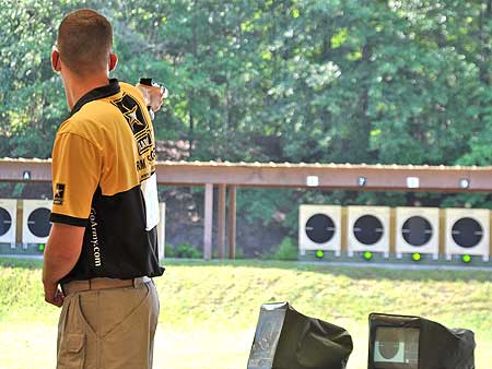 USAMU-Cpl-Brad-Balsley FORT BENNING, Ga. -- Cpl. Brad Balsley, U.S. Army Marksmanship Unit, competes in the final round of the Men's Raid Fire Pistol match during the 2010 U.S. National Rifle and Pistol Championships. Balsley won the gold as the International Pistol team collectively won seven medals during the competition. (Photo by Michael Molinaro, USAMU PAO)