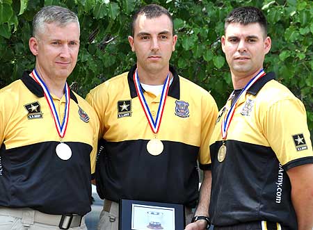 FORT BENNING, Ga. -- Sgt. 1st Class Eric Uptagrafft, Spc. Joe Hein and Sgt. Michael McPhail, all from the U.S. Army Marksmanship Unit, stand atop the podium after finishing 1st-3rd in Men's Prone Rifle at the 2010 U.S. National Rifle and Pistol Championships. Hein won the event and medaled in two others. (Photo by Michael Molinaro, USAMU PAO) 