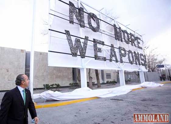 Felipe Calderón unveils the 'No More Weapons' advertising board. Photograph: Reuters