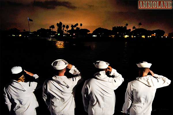US Navy Sailors Saluting the USS Utah Memorial in Honolulu Harbor.