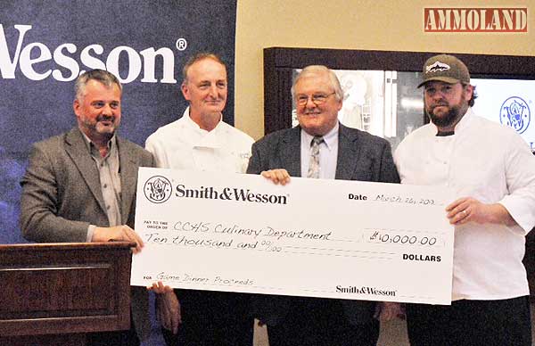 From Left to Right - Smith & Wesson?s James Debney with Norm Boucher, Kenneth Widelo and Ryan Rege from the Chicopee Comprehensive High School