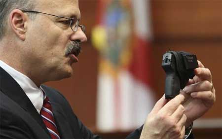 Assistant state attorney Bernie de la Rionda showed the jury George Zimmermans gun