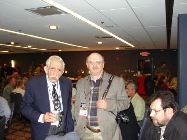 Joe Tartaro and Dave Workman Stop by the table of David Codrea at  GRPC