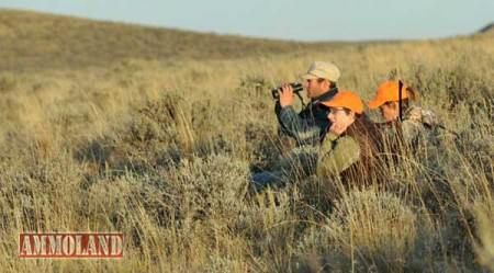 Ann Stebner Steele and Indy Burke, both of Laramie, Wyo., patiently wait out the antelope very early in morning on the Packard Ranch with their guide Mason.