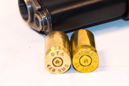 Note the small rifle primer on the .450 SMC case on the left.