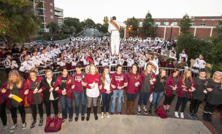 The Florida State University Marching Chiefs play during the Gathering of Unity candlelight vigil on campus.