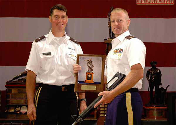 SSG Brandon Green (right) received the first Junior Distinguished Badge in 2001 – appropriately labeled Badge #1. Since then, he has become a member of the Army Marksmanship Unit and even earned the Mountain Man Trophy as the overall rifle competitor at CMP’s 2014 National Trophy Rifle Matches.