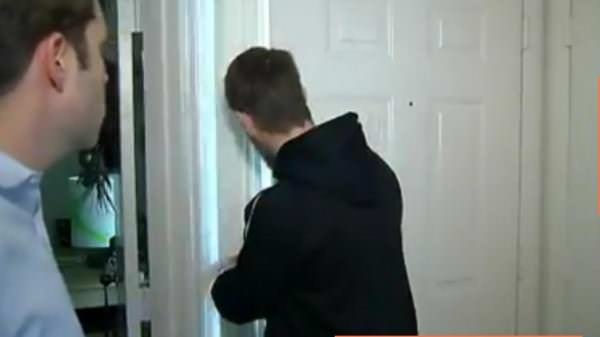 The boyfriend checked the peephole before opening the door.  FSU Student Cracks Door