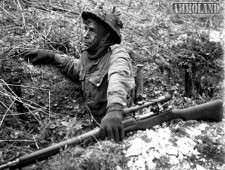 Canadian soldier with a P-14 Enfield rifle with scope, on a training exercise in England, 23 Apr 1943. (Library and Archives Canada Photo, MIKAN No. 3596209)