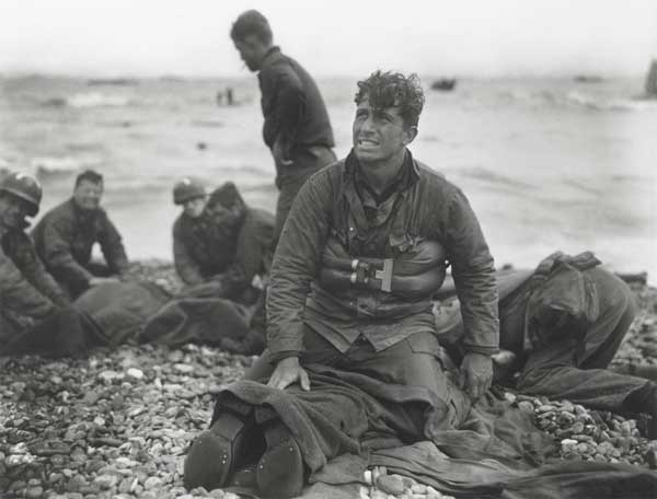 Survivors Help The Wounded on Omaha Beach Survivors Help The Wounded on Omaha Beach