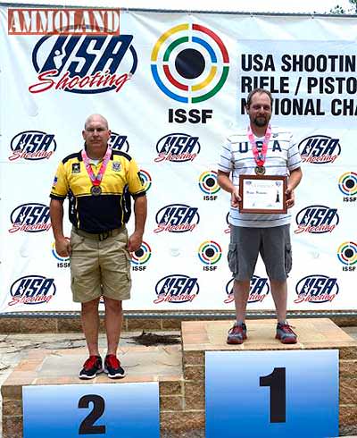 Fort Benning, GA  - Sgt. 1st Class James Henderson stands atop the podium after winning second place in Men's Free Pistol during the 2015 USA Shooting Rifle and Pistol National Championship.