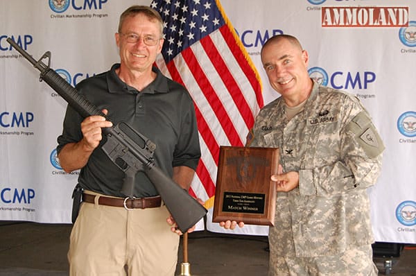 Victor Betzold was the overall winner of the Carbine Match â€“ setting a new record. He was also the overall winner in the Garand Match and earned the Three Gun Aggregate honor. Mrs. Judy Legerski, Chairman, CMP Board of Directors, presented Victor with his trophy plaque.