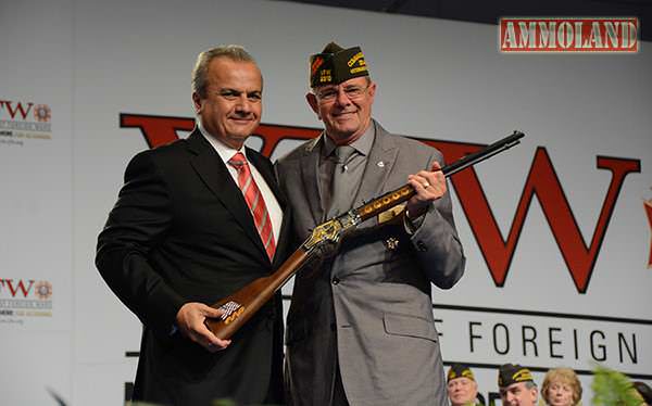 VFW Commander-in-Chief John W. Stroud being presented with a Henry Military Service Tribute Rifle by Anthony Imperato, President of Henry Repeating Arms at the VFW National Convention.