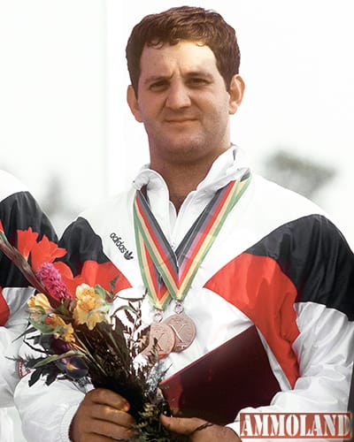 Army CPT Glenn Dubis stands on the winner's platform between two other members of the U.S. men's small bore rifle team after he was awarded gold medals in both the individual and team categories at the 10th Annual Pan American Games. Exact Date Shot Unknown