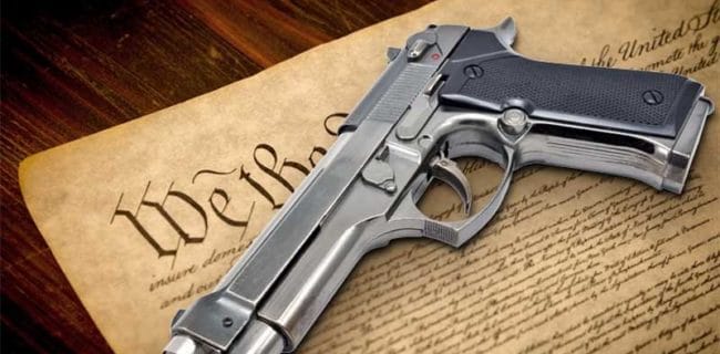 Constitutional We the People right to keep and bear arms second amendment Constitution United States America On Wooden Shutterstock 145503493