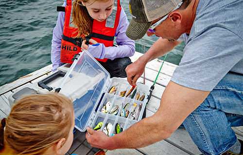 Kids love bait and lures. Provide an explanation of what may work best and why, but allow them to experiment. Photo courtesy of www.planomolding.com