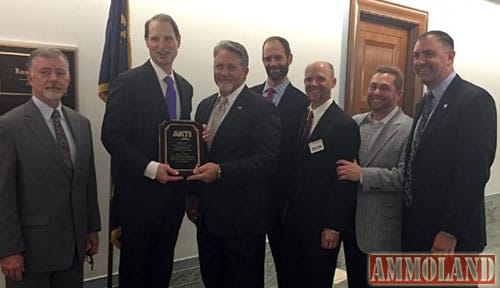 AKTI Board members presenting Common Sense Award to Oregon Senator Wyden. Dan Lawson (Microtech), Sen. Wyden, CJ Buck (Buck Knives), David Fee (Benchmade), Bill Raczkowski (Gerber), Morgan Taylor (Taylor Brands), Mark Schreiber (CRKT)