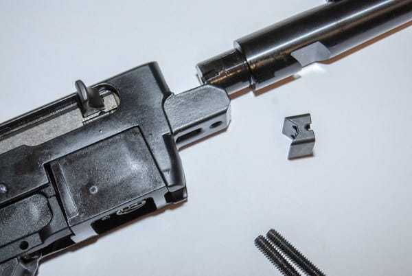 The Ruger 10 22 Rifle barrel is mounted with this v-block and two screws. The Ruger 10 22 Rifle barrel is mounted with this v-block and two screws.