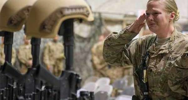 Service members from several units at Bagram Airfield, Afghanistan pay their respects during a Dec. 23 fallen comrade ceremony held in honor of six airmen who lost their lives in an improvised explosive attack near Bagram on Dec. 21 2015. (Photo: Tech. Sgt. Robert Cloys/Air Force)