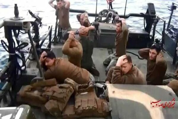 American military personnel on their boat after they were captured by the Iranian Revolutionary Guard Corps. img Iran Navy