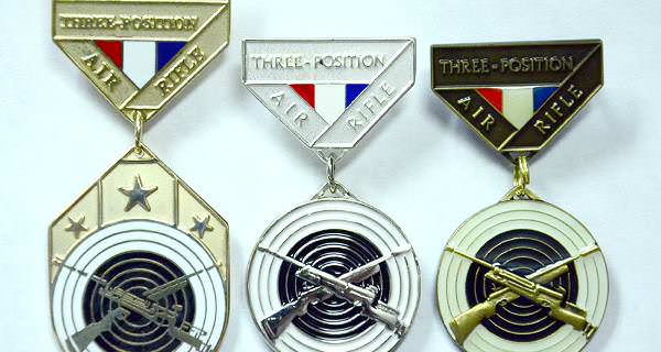 CMP awards bronze and silver EIC badges along with the gold Junior Air Rifle Distinguished Badge.