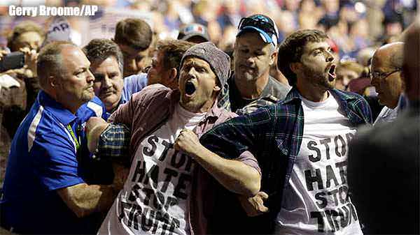 Protesters are removed as Republican presidential candidate Donald Trump