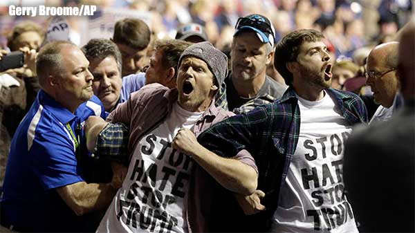 Protesters are removed as Republican presidential candidate Donald Trump prepares to speak.