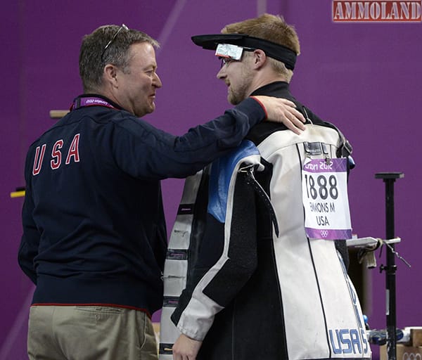 Aug 6, 2012; London, United Kingdom; Matt Emmons (USA) and his coach David Johnson talk in the men's 50m rifle 3 position final during the London 2012 Olympic Games at Royal Artillery Barracks. Mandatory Credit: Richard Mackson-USA TODAY Sports