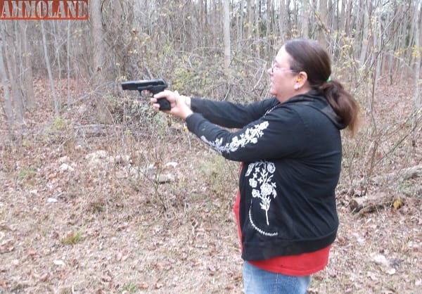 Female Shooting 9 mm with Crimson Trace Laser Grip