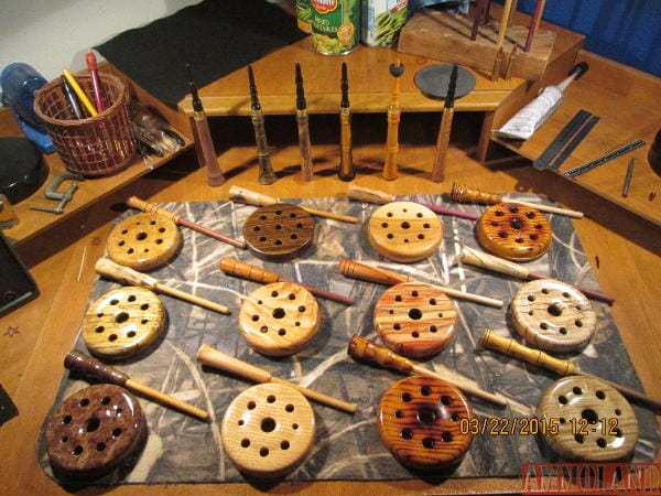 A collection of custom turkey pot calls with turkey trumpet calls in the background.