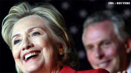 Hillary Clinton with Terry McAuliffe coming from behind.